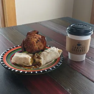 a plate of food and a cup of coffee