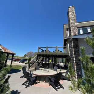 a patio with a table and chairs