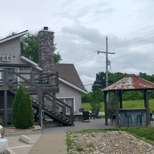 Image of patio with fire pit to the right.