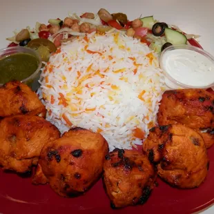 a plate of food with rice and vegetables