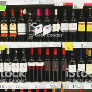 rows of wine bottles in a store
