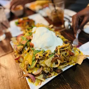 World Famous Campuzano Nachos with shrimp, fajita beef and chicken.