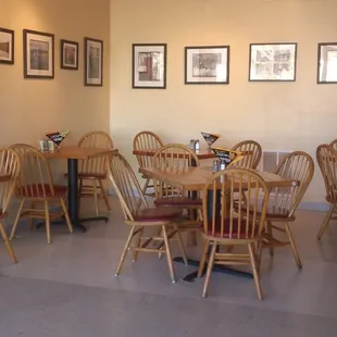 a dining area with tables and chairs