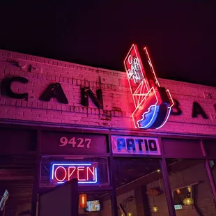 a neon sign on the side of a building