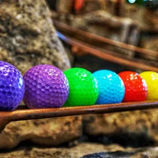 multi-color golf balls at Can Can Wonderland mini golf