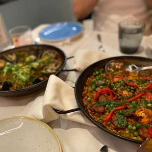 two pans of food on a table