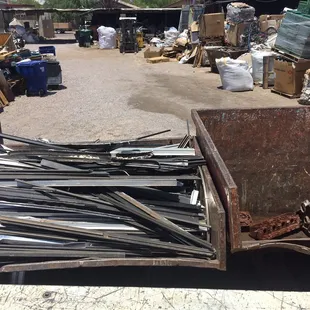 We filled up that entire dumpster on the left. Those are deep dumpsters too.