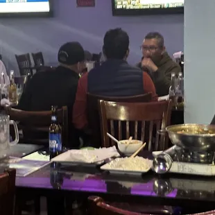 a group of people sitting at a table