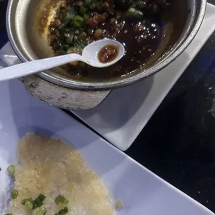 a bowl of soup and a plate of rice