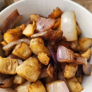 a bowl of fried potatoes and onions