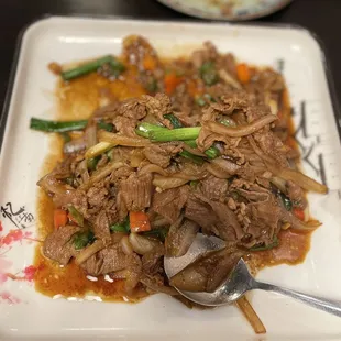 a plate of meat and vegetables