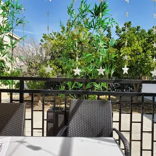 Outside dinning area sat at last table towards the back. Nice sunny day with a breeze.