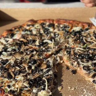 a whole pizza in a box