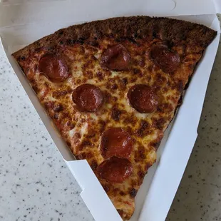 Slice of Pepperoni Pizza. Not bad, but the crust was almost burnt :(