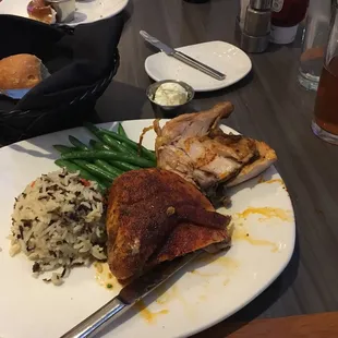 Herb Roasted Half Chicken with vegetable of the day and rice pilaf