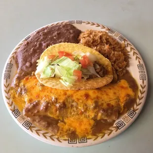 Our most popular plate:Mexican plate;consists of two enchiladas ,rice ,beans and a crispy taco