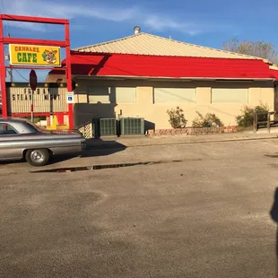 a car parked in front of the restaurant