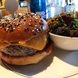 a hamburger with a side of vegetables