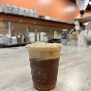 a cold beverage in a plastic cup