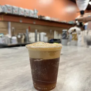 a cold beverage in a plastic cup