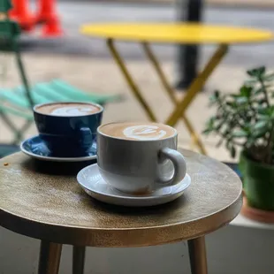 two cups of coffee on a table