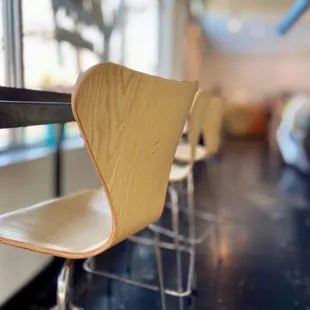 a row of chairs in a coffee shop