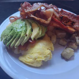 Egg Stack - Three Eggs Scrambled with Bacon, Avocado, Fresh Tomatoes &amp; Salsa,
Home Fries &amp; Toast