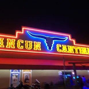 a neon sign for a mexican restaurant