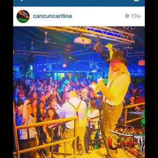 a man on stage with a microphone