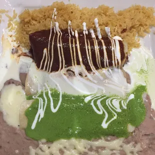 Enchilada Bandera. Was super good and pretty. The spinach sauce kicks ass