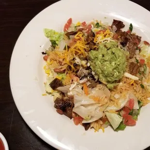 Fiesta salad with beef fajita meat.