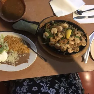 Huge portion of shrimp fajitas, plus rice and beans and tortillas.