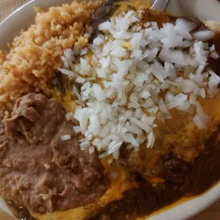 Cheese enchilada plate with added fresh onions