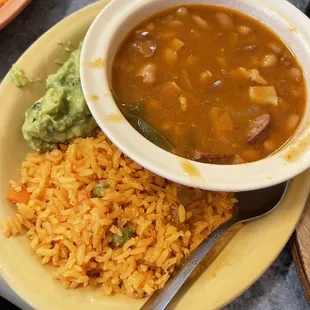 Very generous amount of guac (partially covered), charro beans and rice