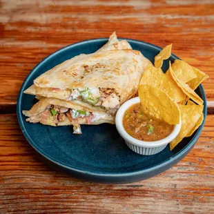 Quesadilla
 
 Choice of Protein, Flour Tortilla, Jack Cheese, Guacamole, Sour Cream, Pico de Gallo &amp; Secret Salsa.