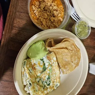 Egg white sandwich in a bowl with a side of chorizo