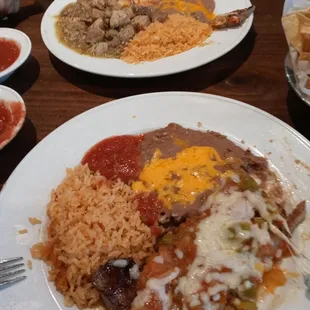 Grill beef with ranchero sauce and pork with green tomatillo sauce both with rice and beans.