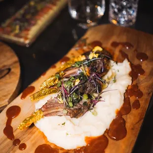 Lamb Rack Over Mashed Potatoes Served With Demi Glaise and Chimichurri