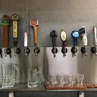 a row of beer taps