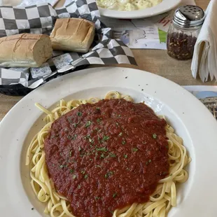 Tortellini Alfredo and Linguine Marinara with side salads.