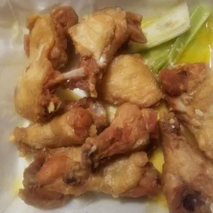 Wings in a pool of butter! So where is the garlic, I just love celery soaked in butter! Disgusting  and gross.
