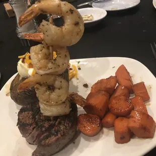 Filet Mignon w/Grilled Shrimp, carrots and a loaded baked potato. Yum!