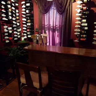 a dining room with a wine rack