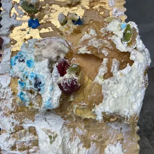Center and upper part of cake in the trash.