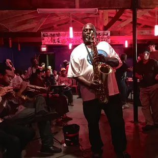 a man playing a saxophone