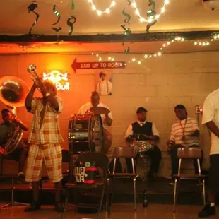 a band playing in a dimly lit room