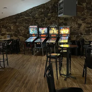 a row of pinball machines