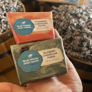 a hand holding two soap bars