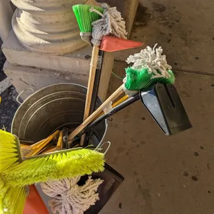 brooms and dust in a bucket