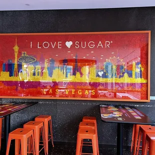 i love sugar sign and orange stools